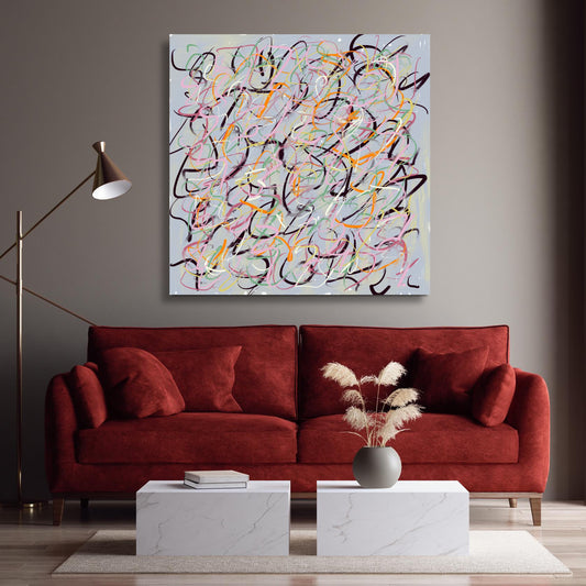 'Champagne Celebration' hanging above a deep red sofa that highlights the deep pink in the art that pops out from the grey wall behind.
