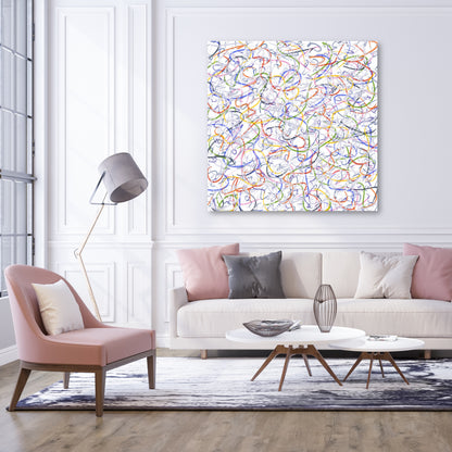 The minimal decor of this mainly white room, softened by accents of pink and grey, provides a perfect setting for this large canvas print version of 'Skiing' which hangs on the wall  above the white sofa.
