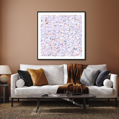 Accentuating the orange and black highlights in 'Snowmelt' the art sits above a white sofa with tan throw and tan and black cushions. The wall behind is a paler orangey-tan and the carpet in the foreground has black and natural highlights.